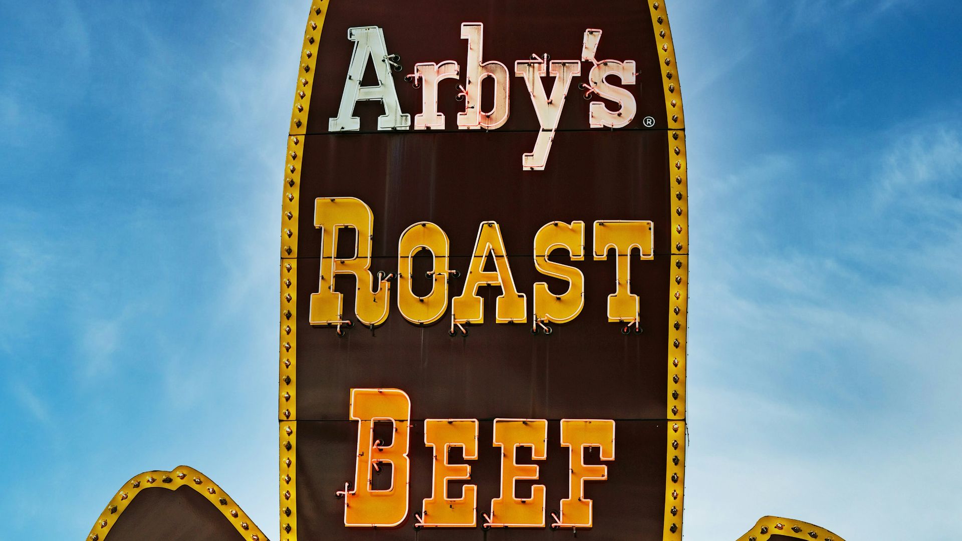 A sign for a restaurant called andy's roast beef sandwich