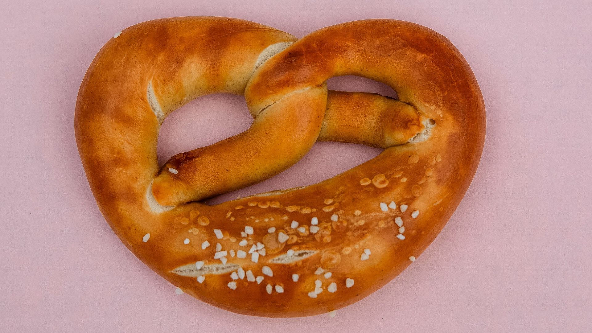 bread knot on pink surface