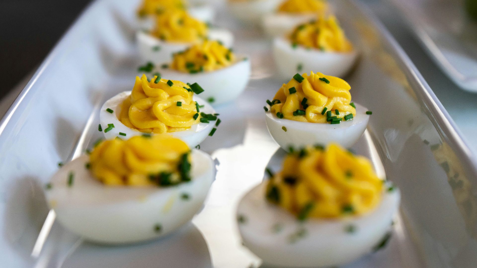 white and yellow icing covered cupcakes