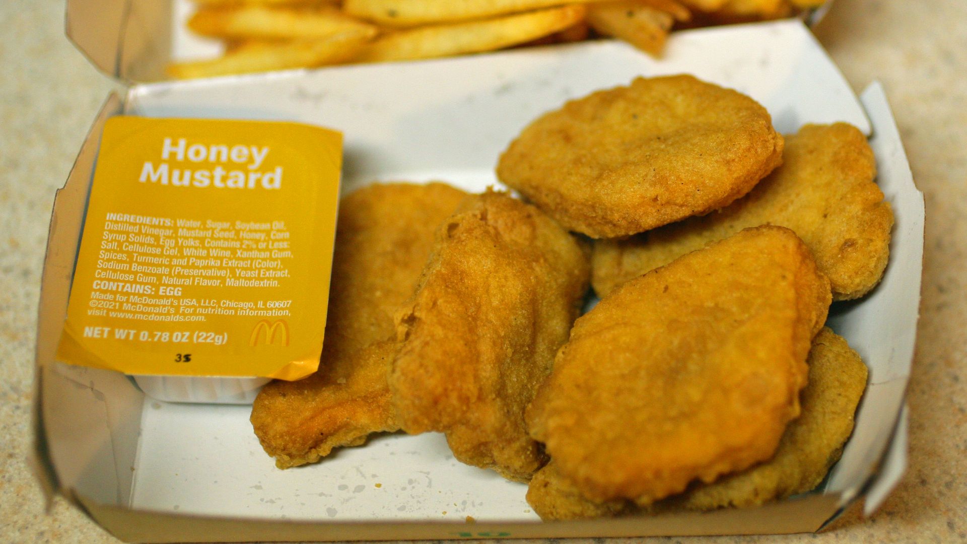Mcdonald's chicken nuggets with fries.