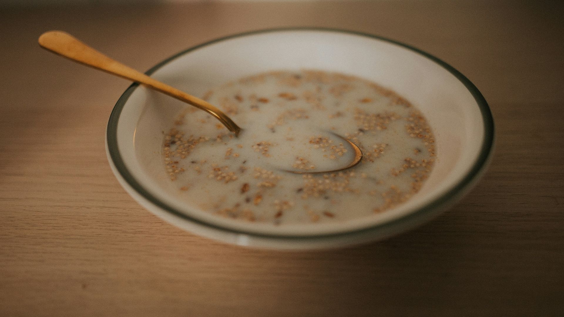 a bowl of cereal with a spoon in it