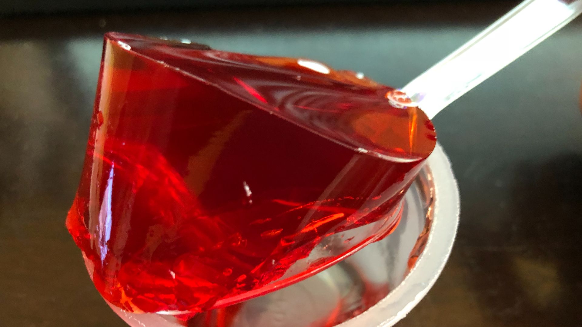 File:2019-10-10 22 15 43 Gelatin from a single opened cup of Jell-O strawberry gelatin snack being lifted by a spoon in the Franklin Farm section of Oak Hill, Fairfax County, Virginia.jpg