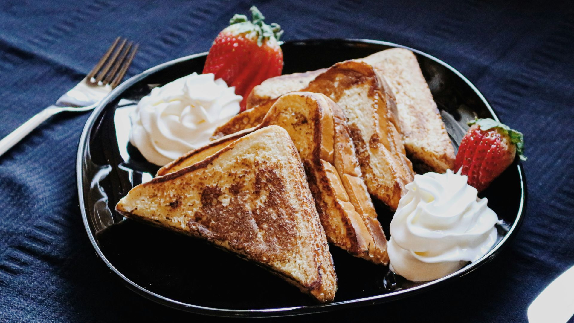 bread on black ceramic plate