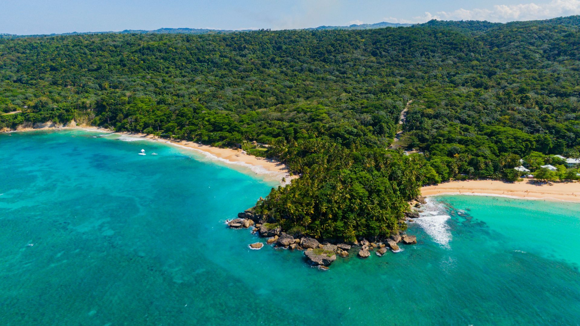 an aerial view of a tropical island in the middle of the ocean