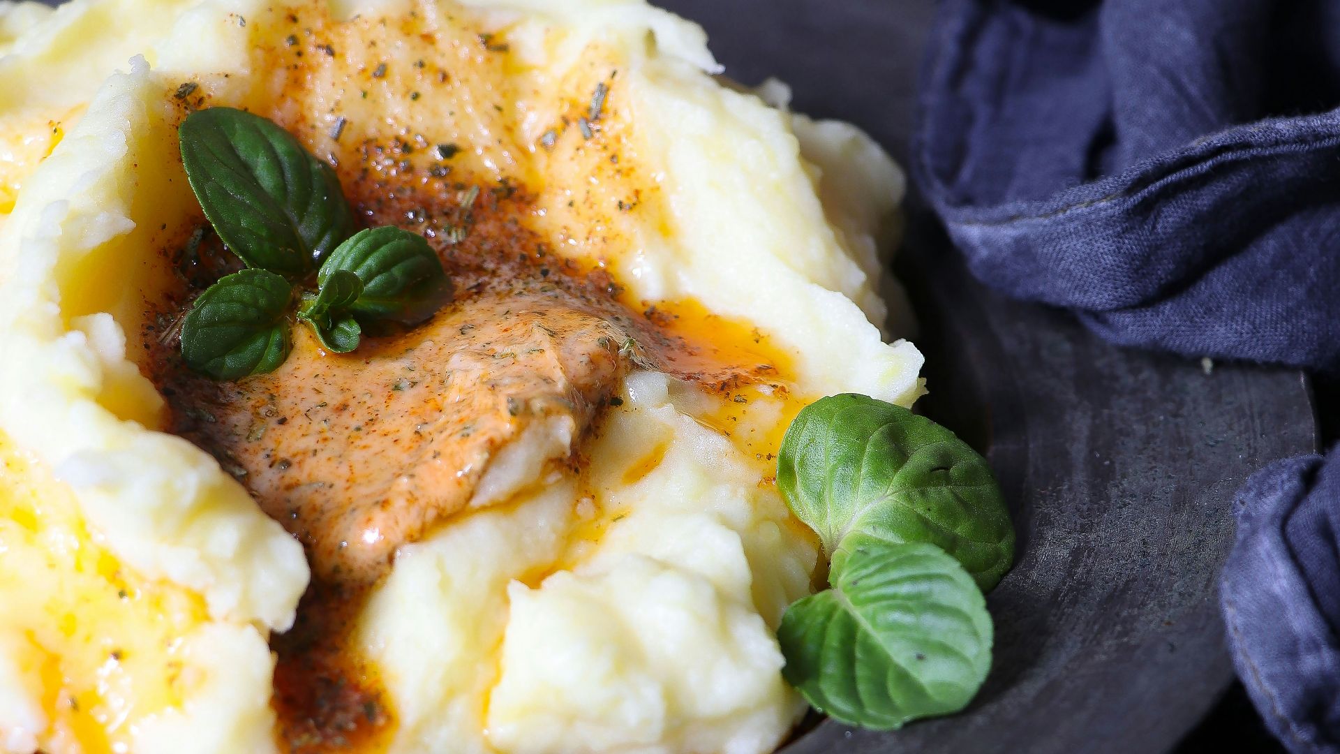 a plate of mashed potatoes topped with gravy