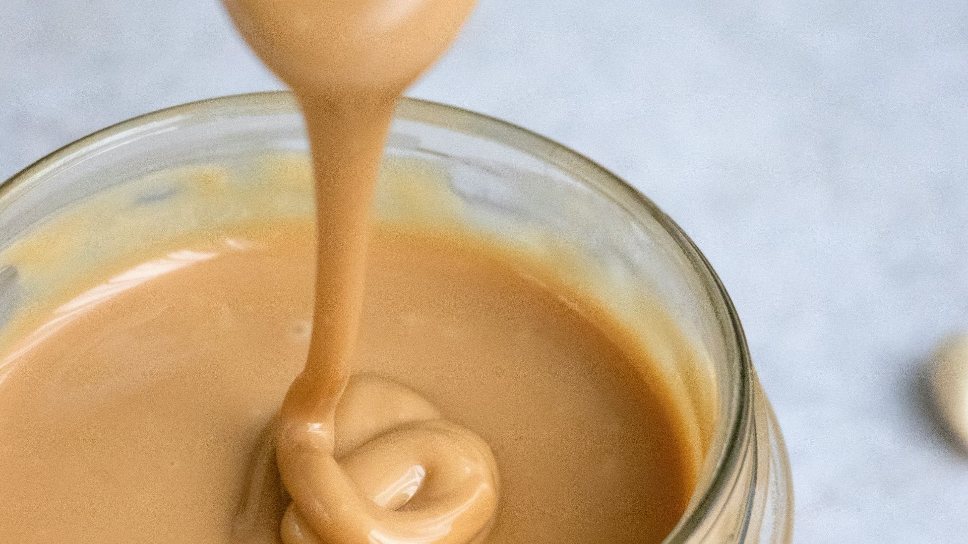 clear glass jar with brown liquid