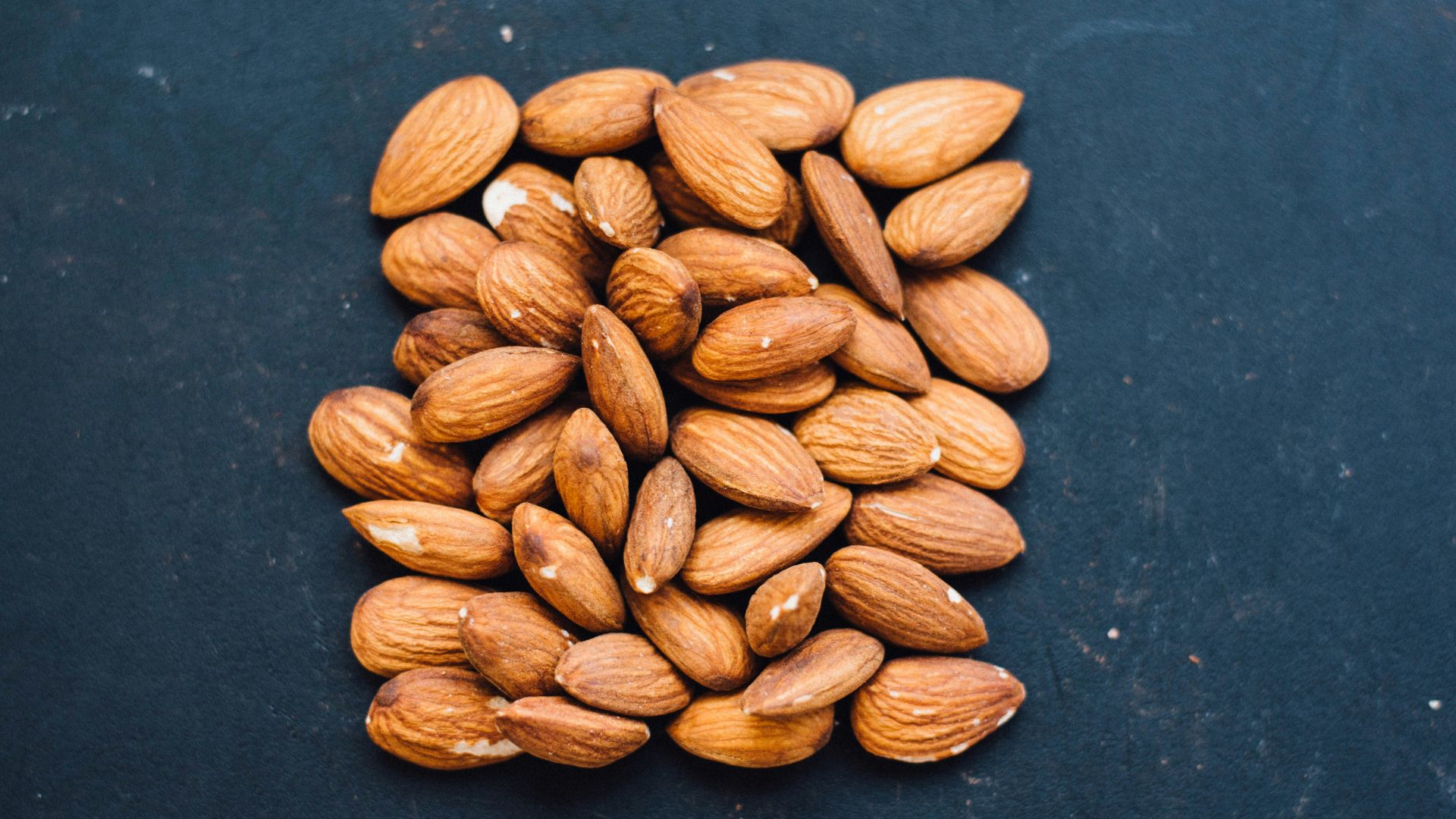 brown nuts on black surface
