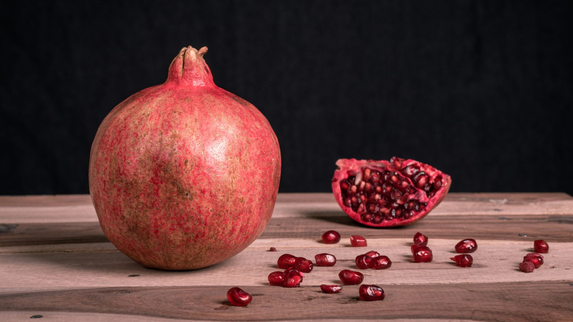 red round fruit on black surface