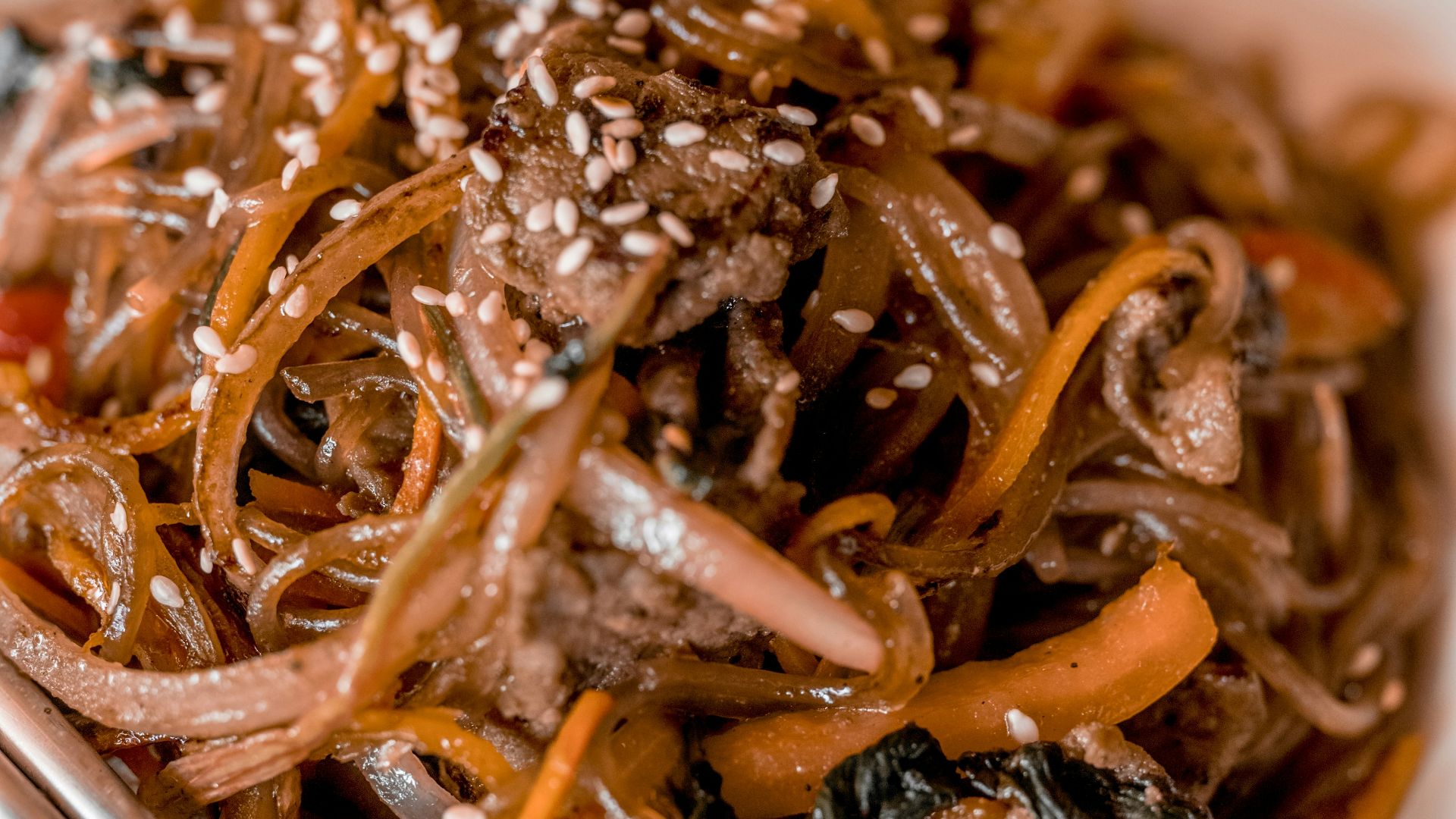 pasta with sauce on white ceramic bowl