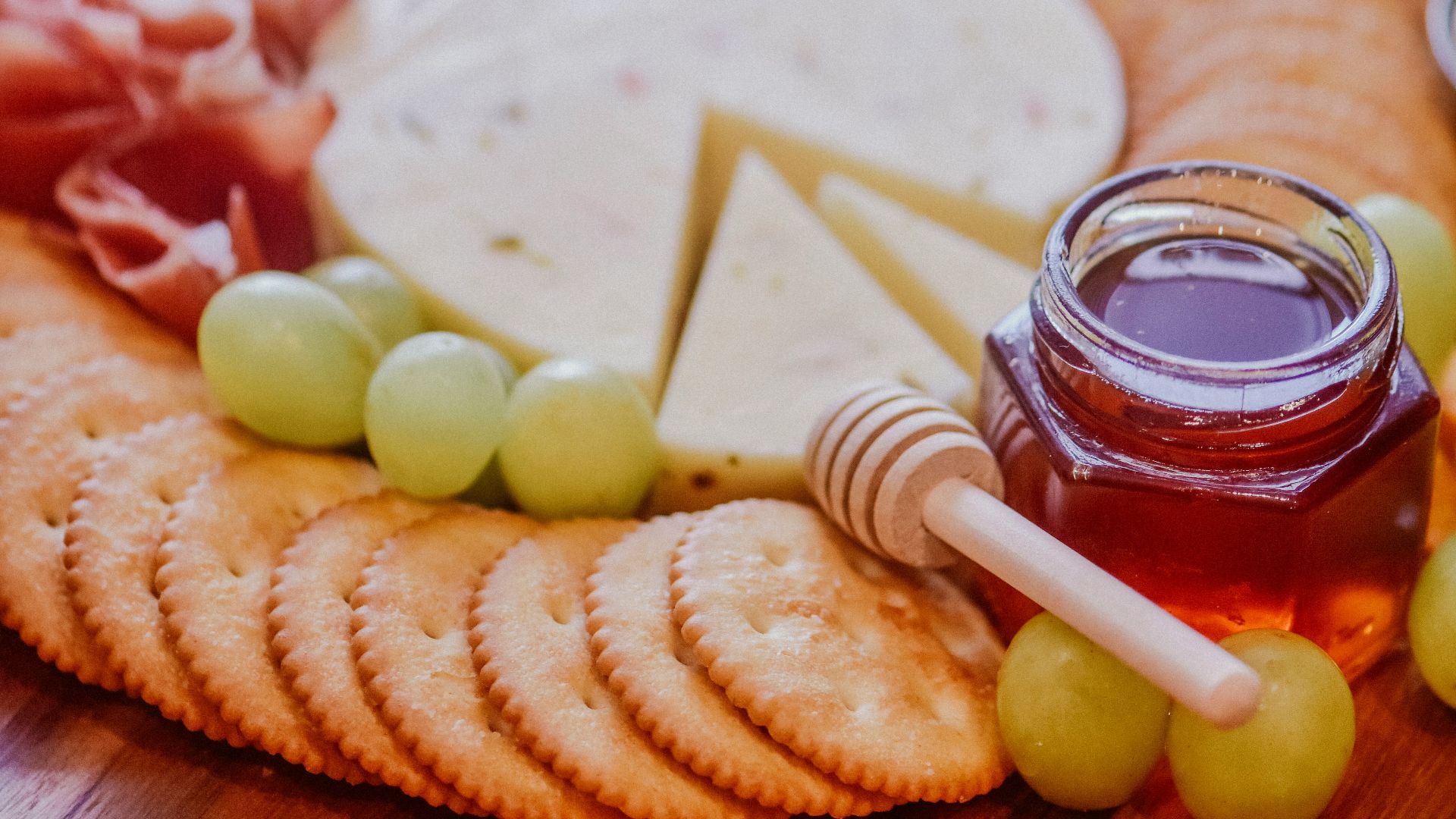 red and white chili peppers on brown wooden table