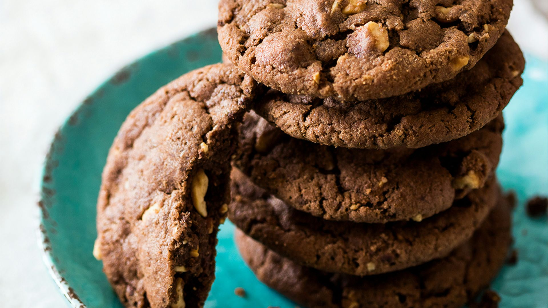 brown cookies on blue and white ceramic plate