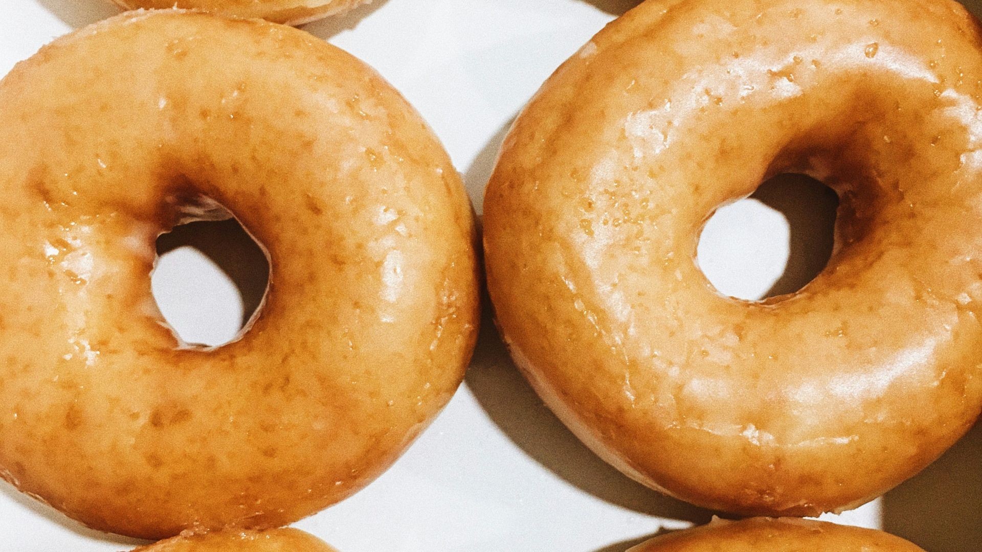 brown donuts on white paper