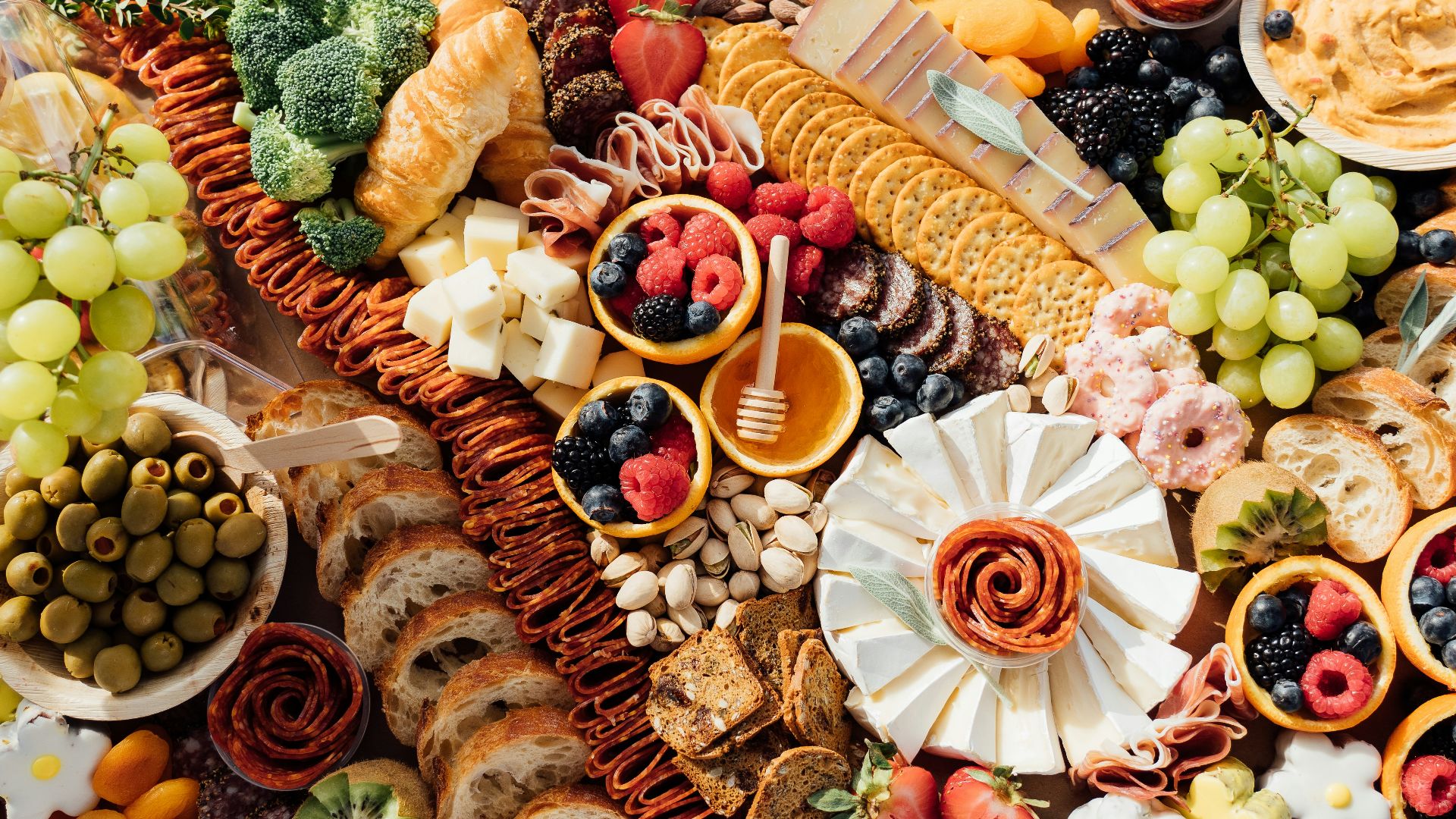 a wooden table topped with lots of different types of food