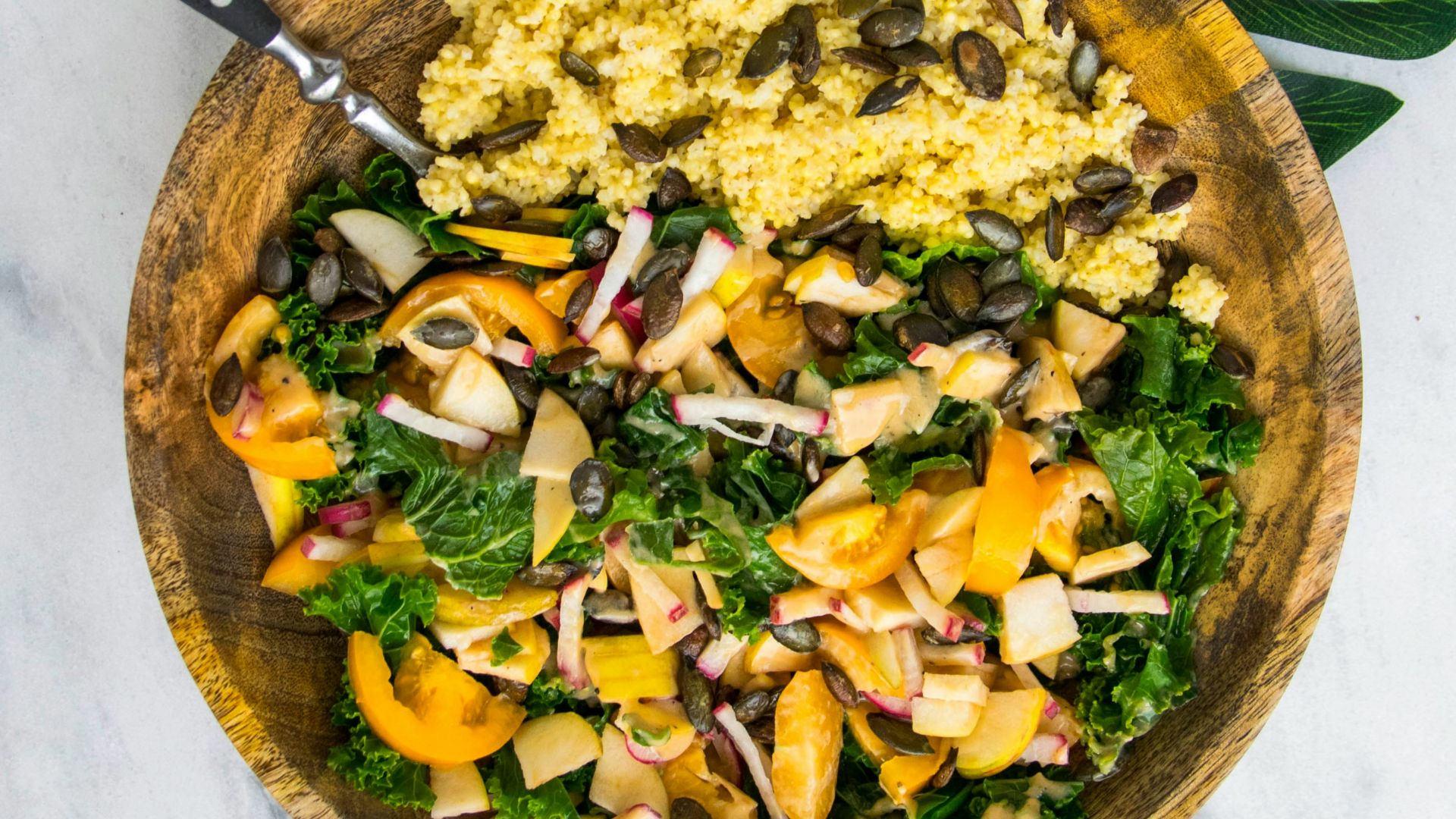 cooked rice with vegetable salad in brown wooden bowl