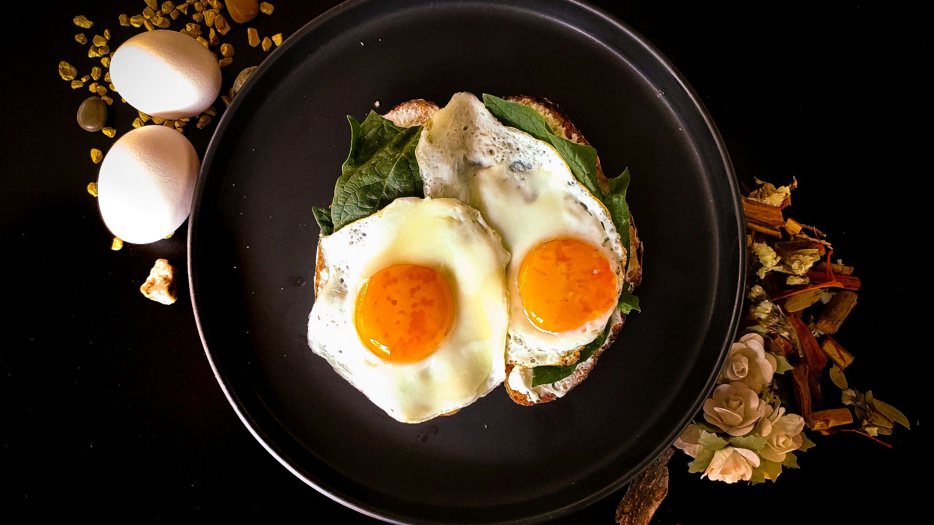 sunny side up egg on black ceramic plate