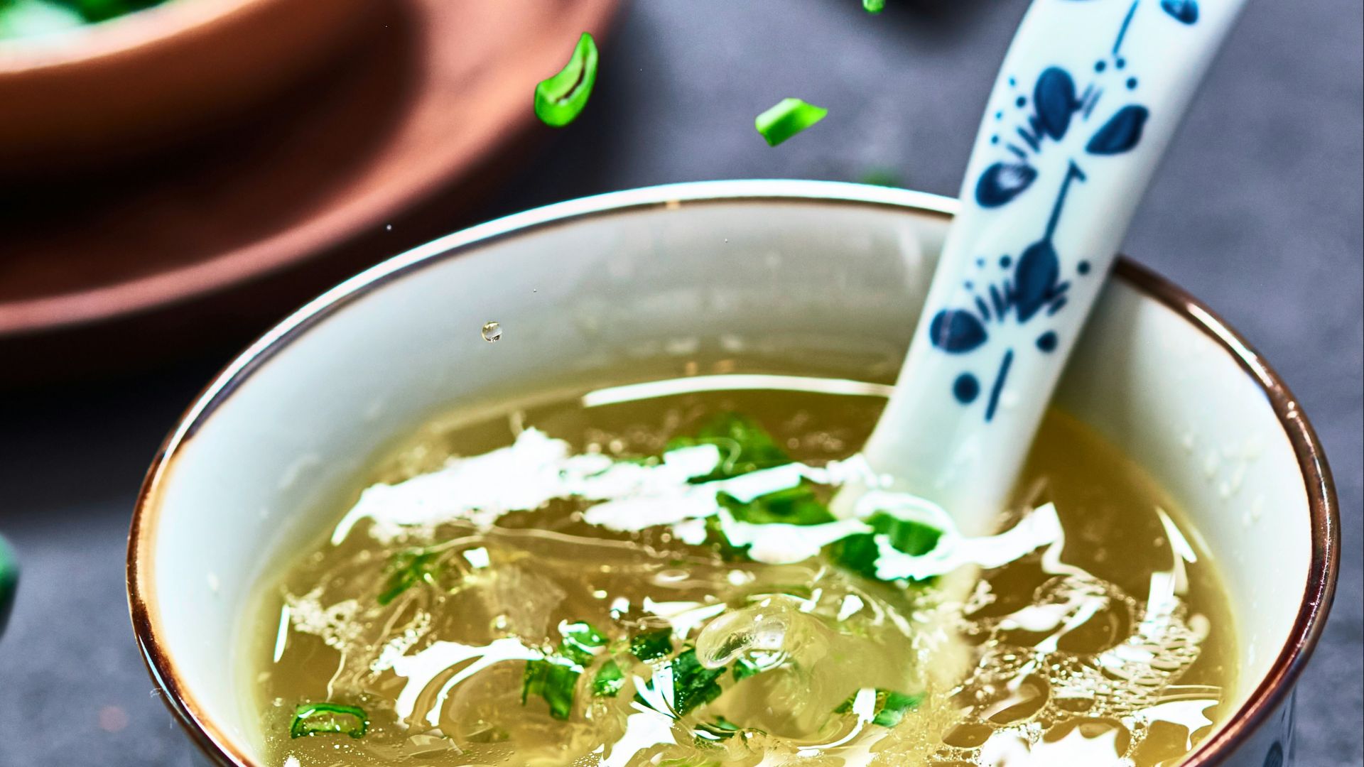 a bowl of soup with a spoon