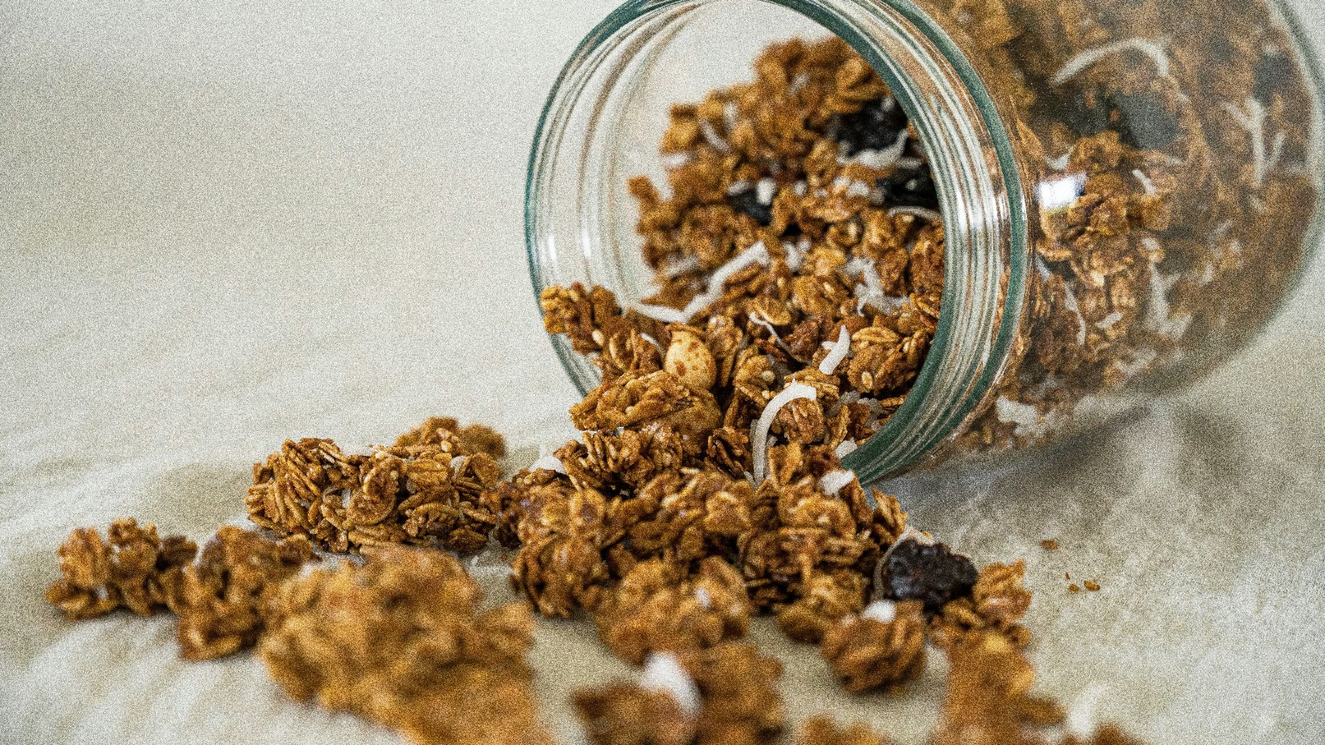 a glass bowl full of dried brown and white grains