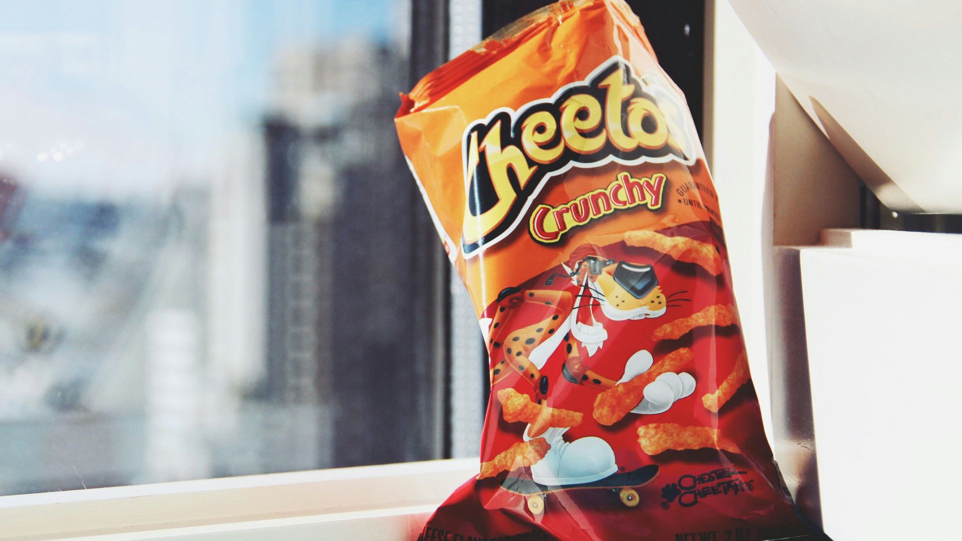 orange and yellow plastic pack on white table