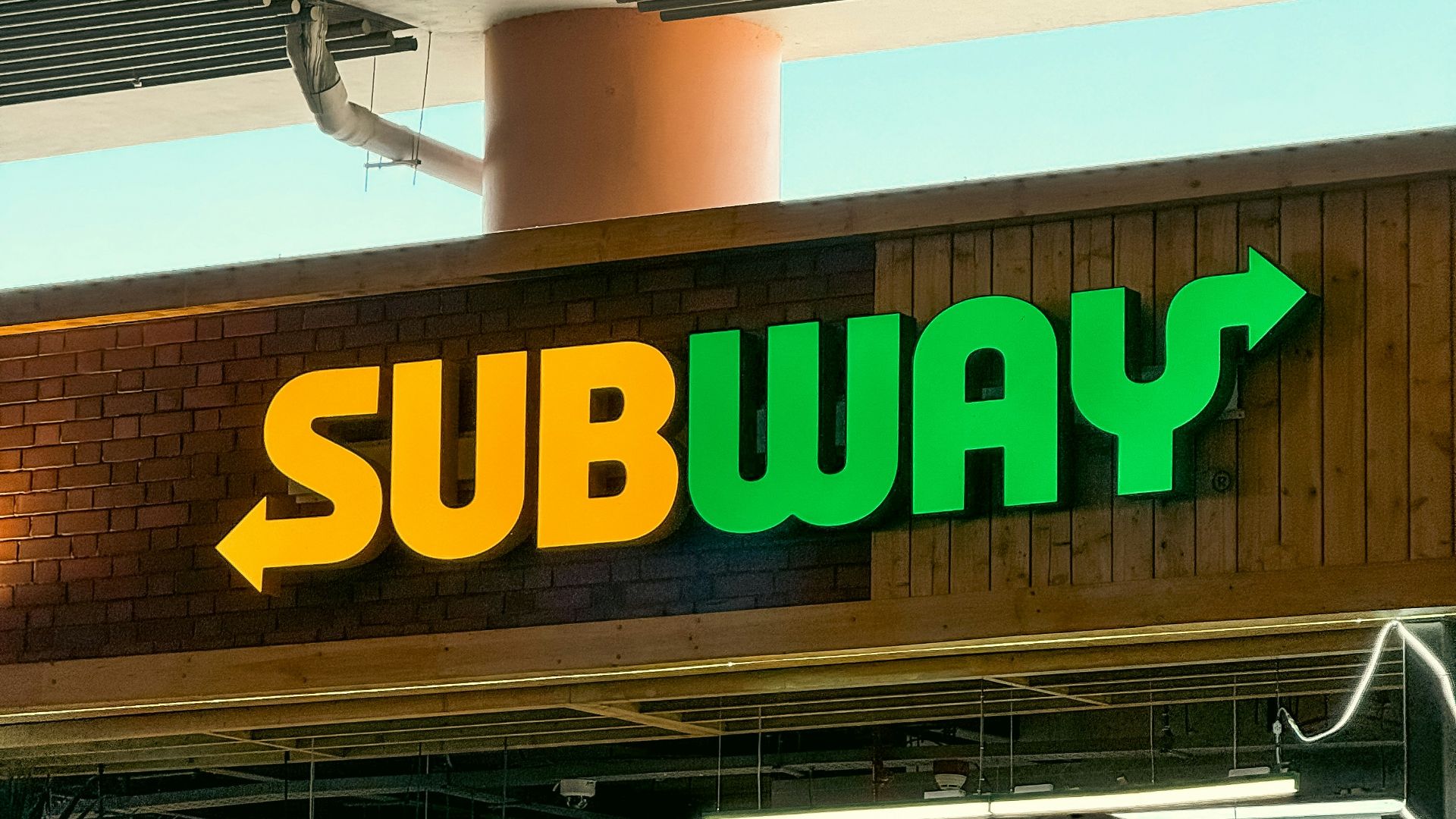 a subway sign above a subway entrance