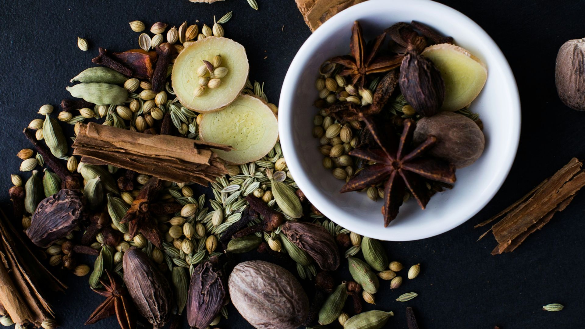 a bowl filled with nuts and spices