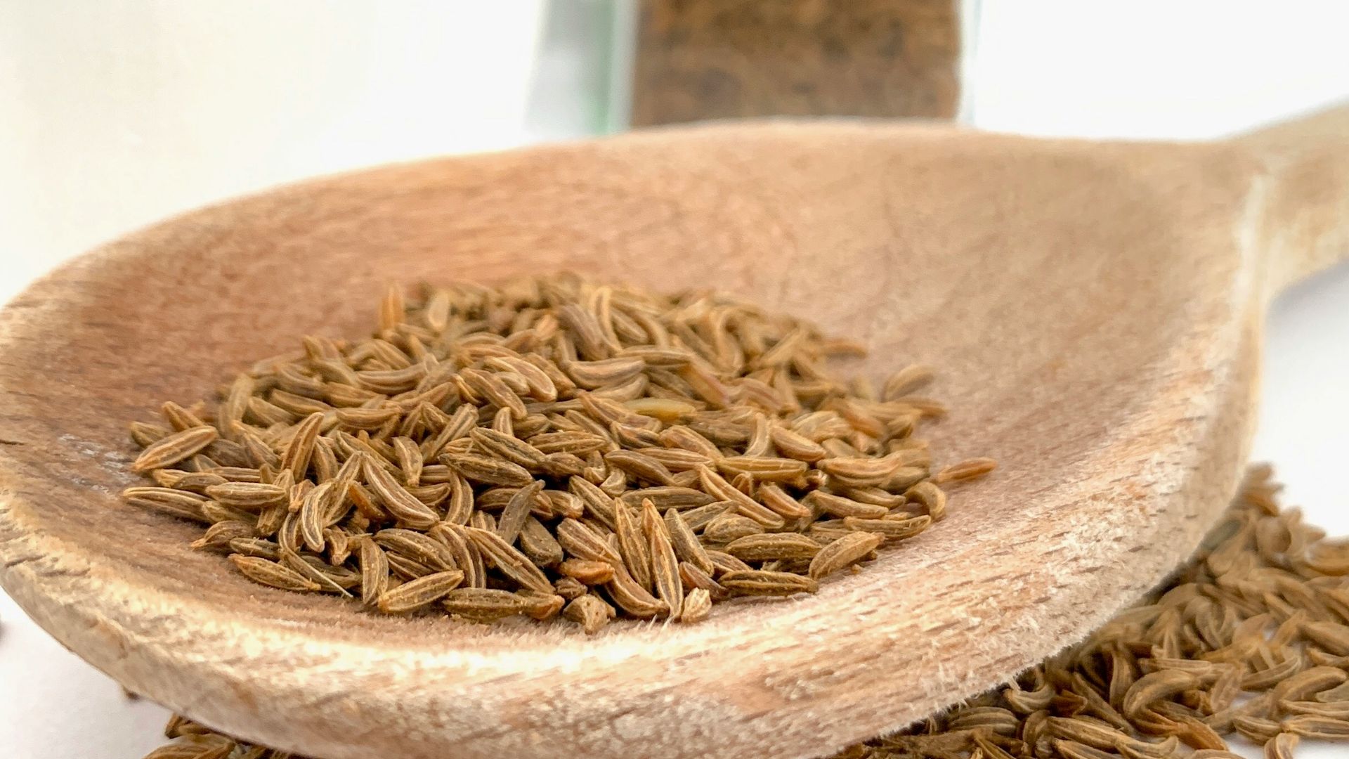 brown wooden spoon on white ceramic bowl