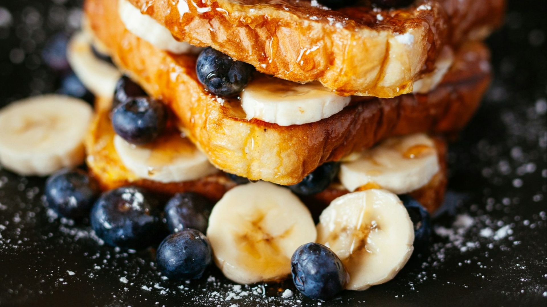 toast bread with blueberry on black plate