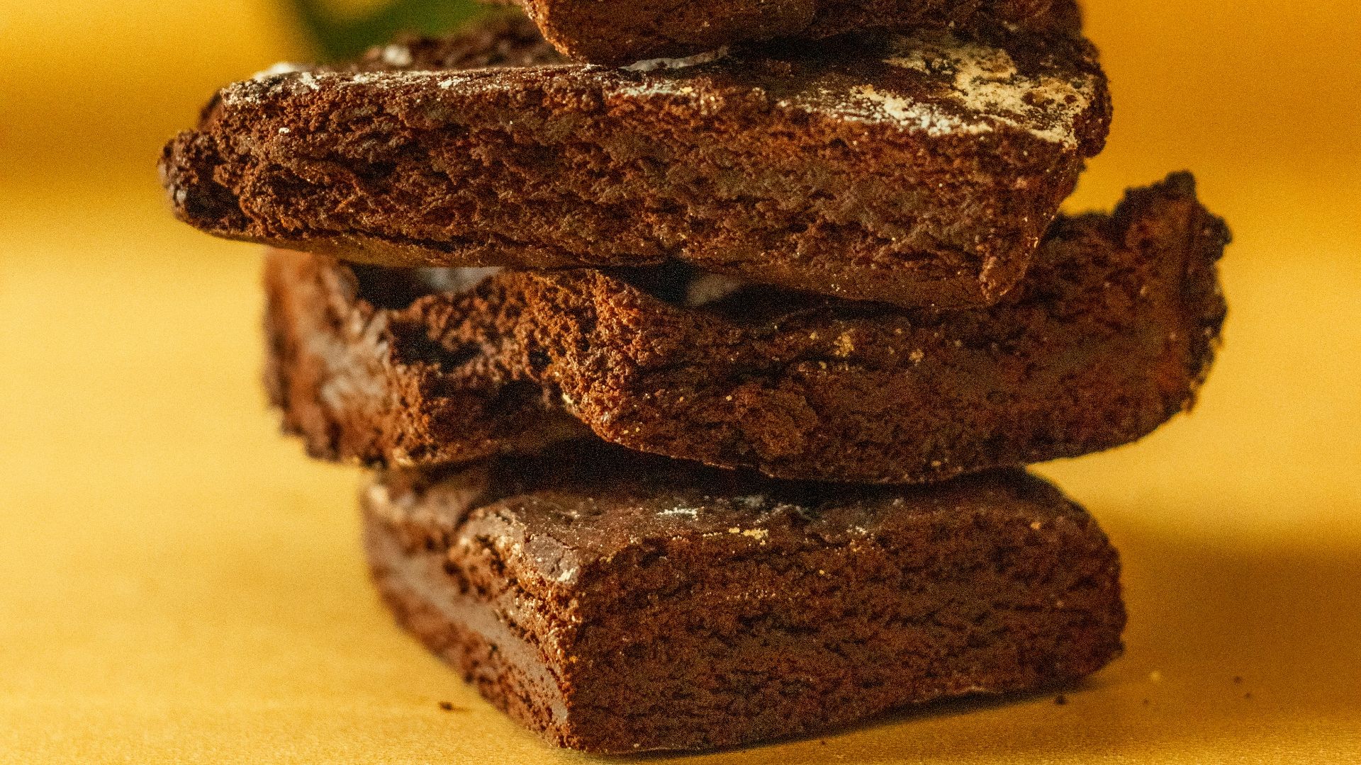 a stack of brownies sitting on top of a table