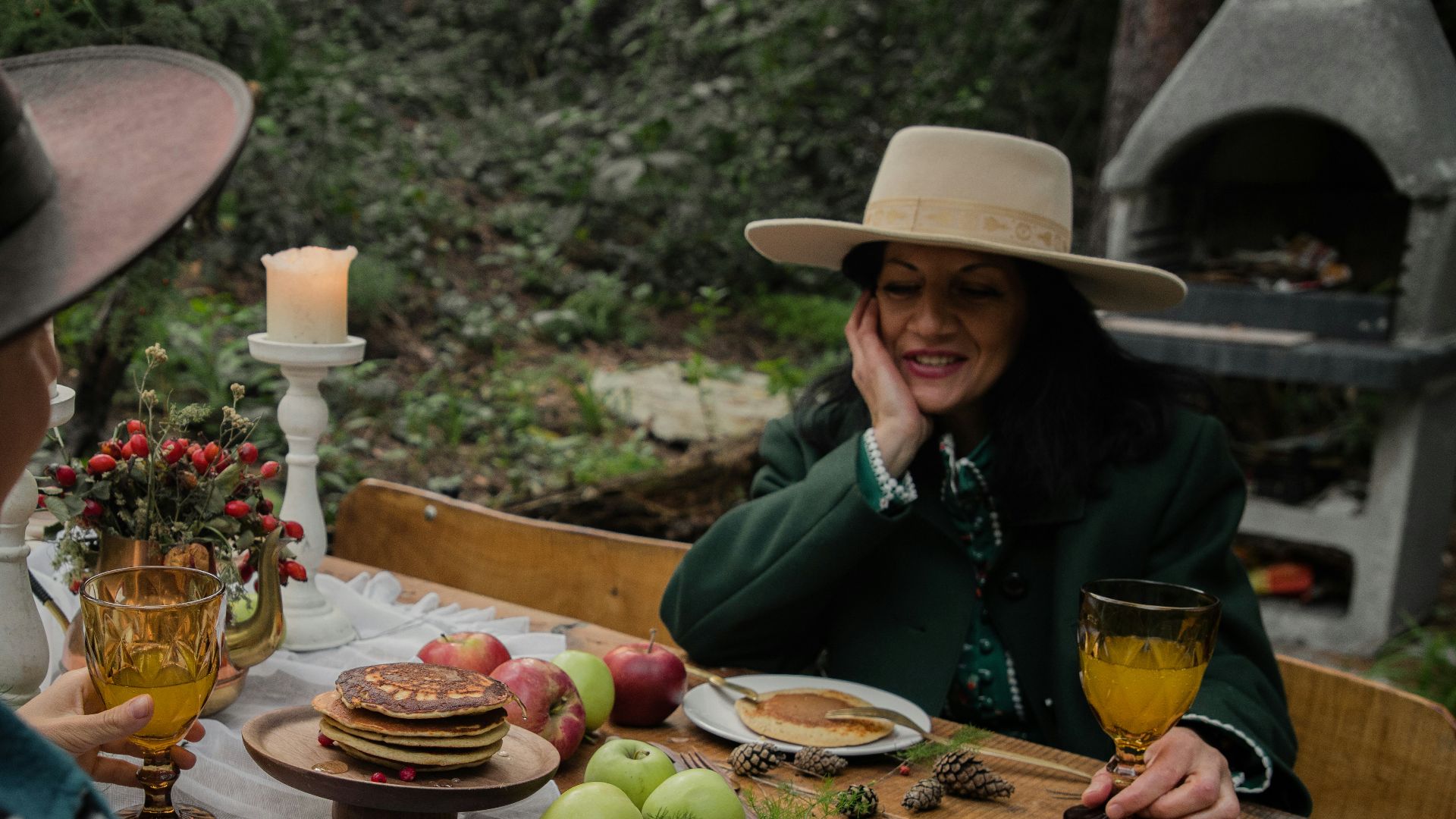 a group of people sitting around a wooden table