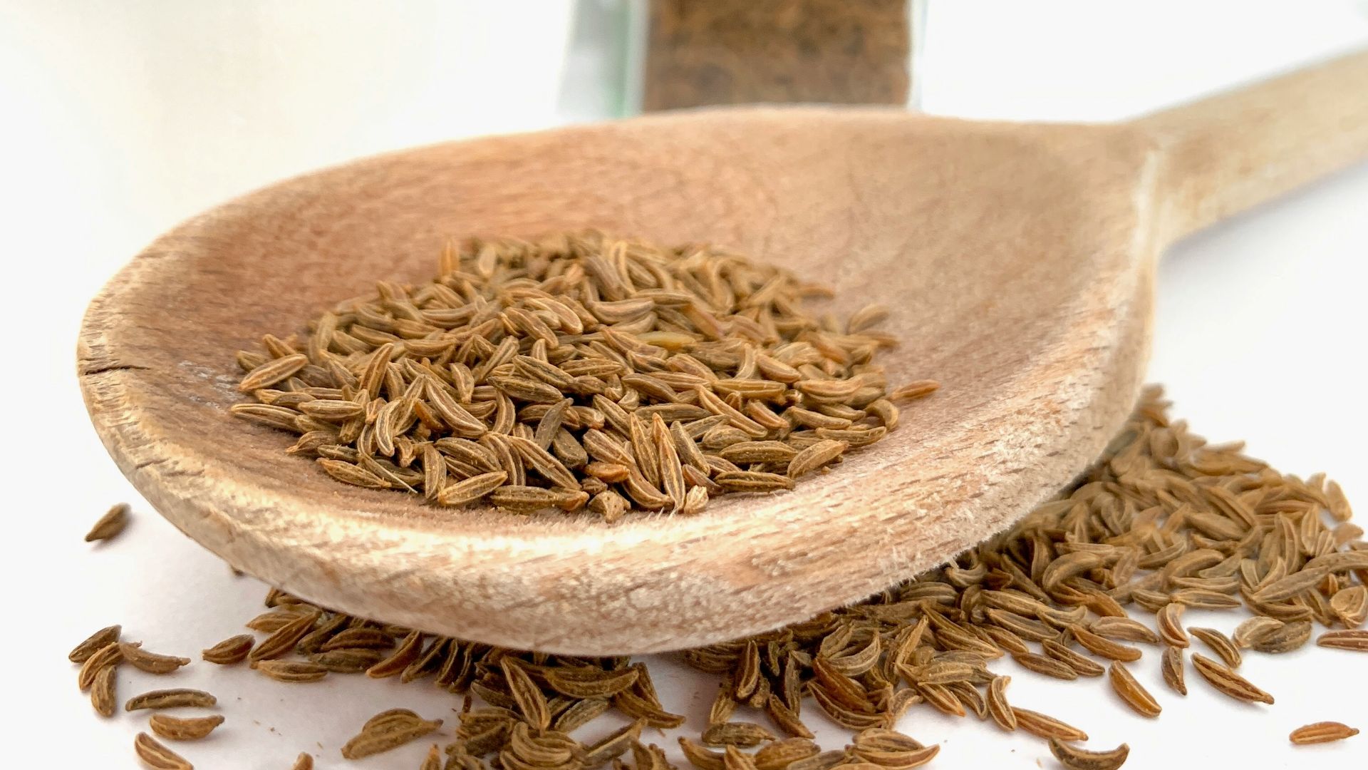 brown wooden spoon on white ceramic bowl