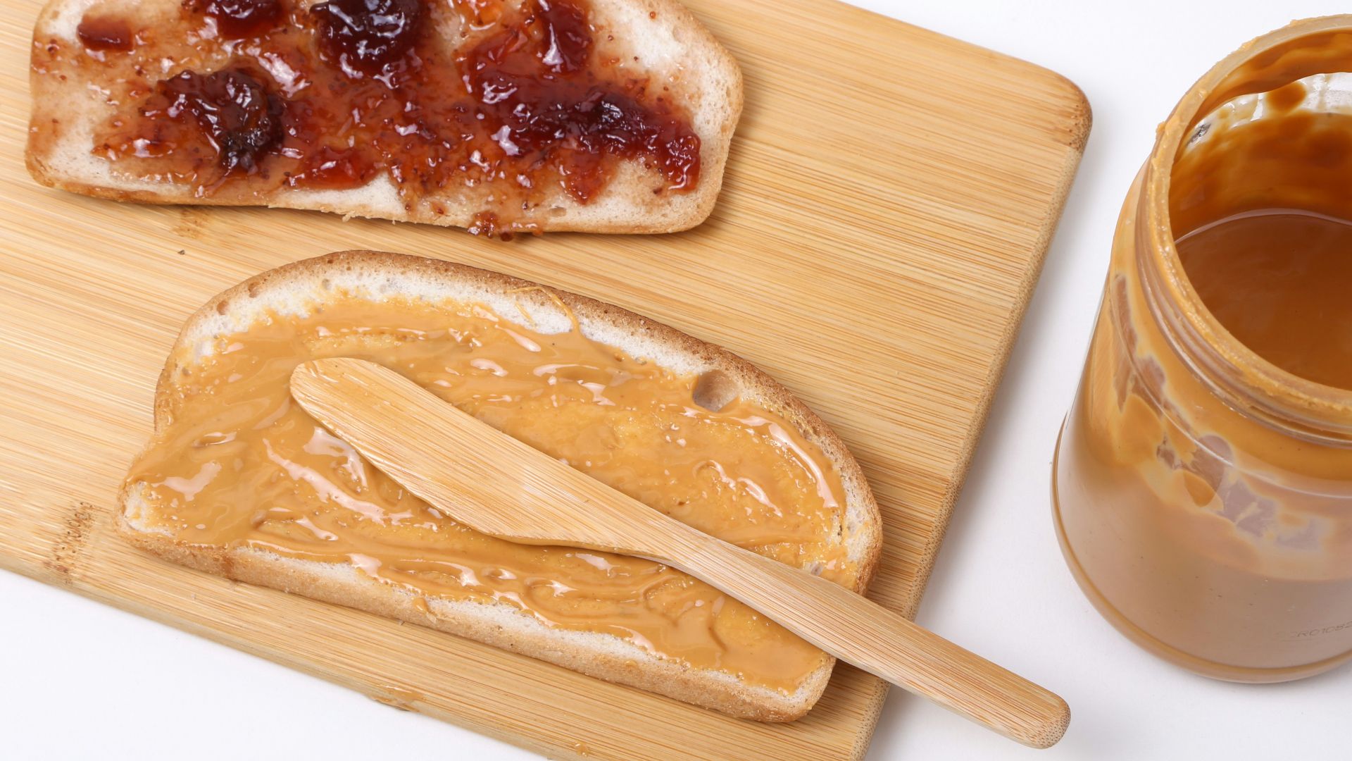 a wooden spoon next to a bowl of food