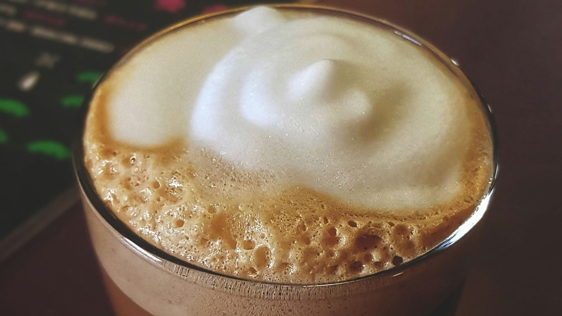 coffee with foam on glass cup