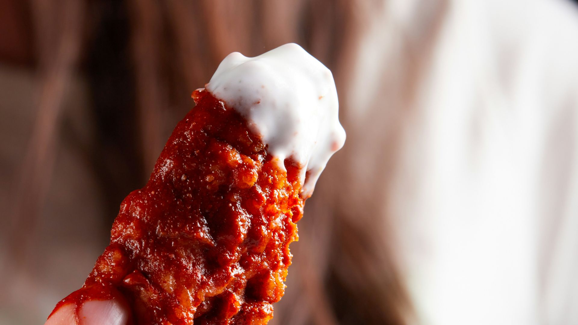 person holding brown and white ice cream
