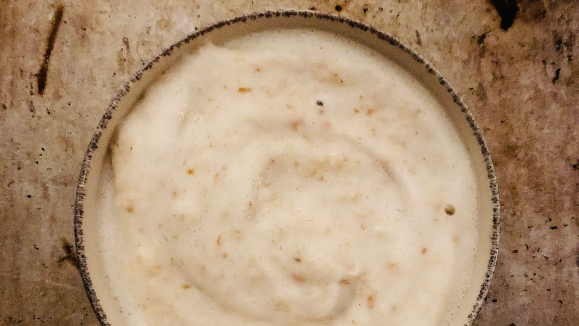 a bowl of food sitting on top of a table