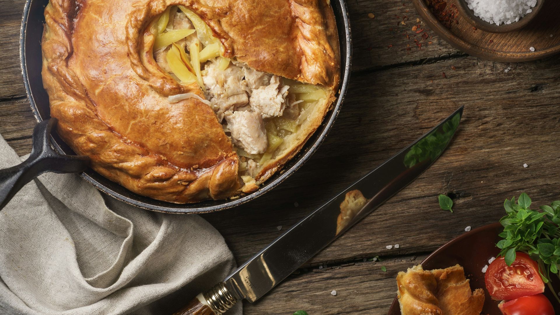 pie on stainless steel bowl beside black handled knife