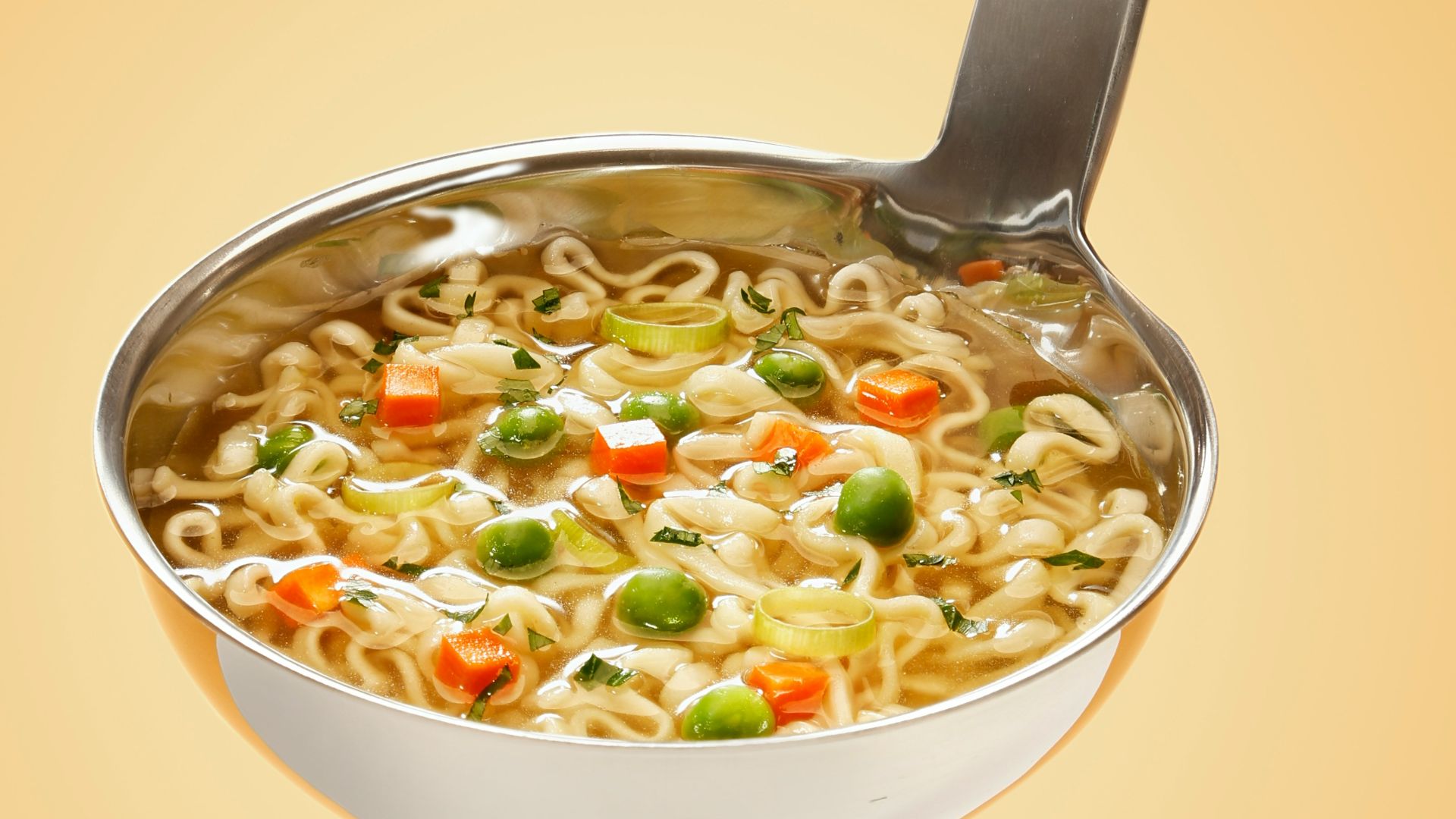 silver steel scoop with noodles