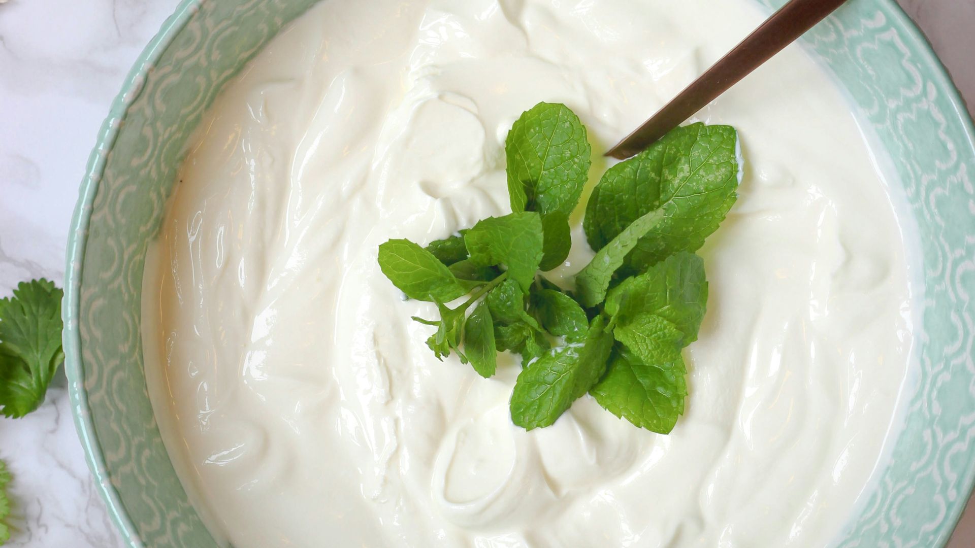 a bowl of yogurt with a spoon in it