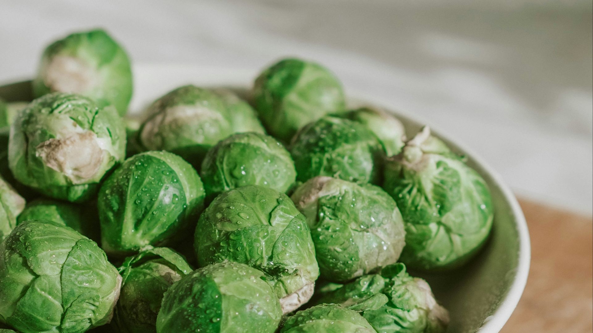 green vegetable on white ceramic bowl