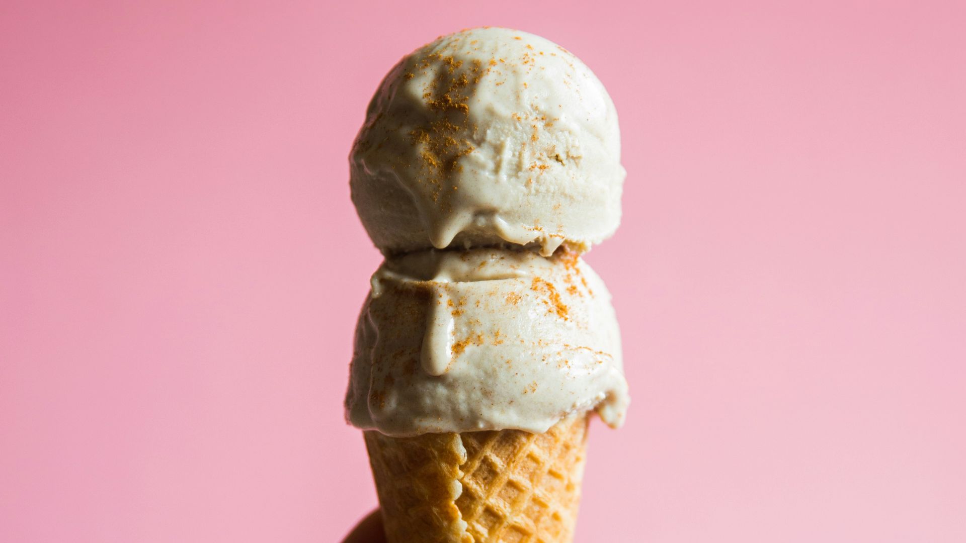 person holding ice cream on cone
