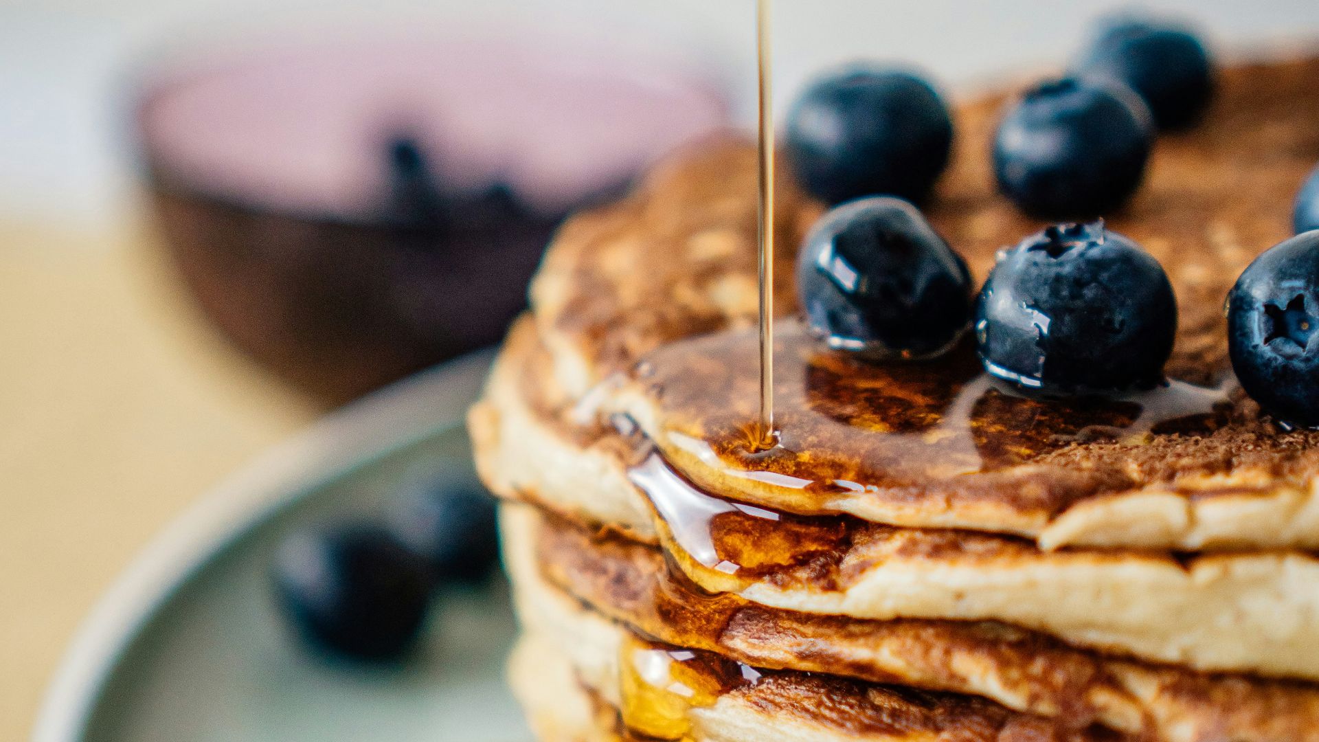 pancakes with blueberries on white ceramic plate