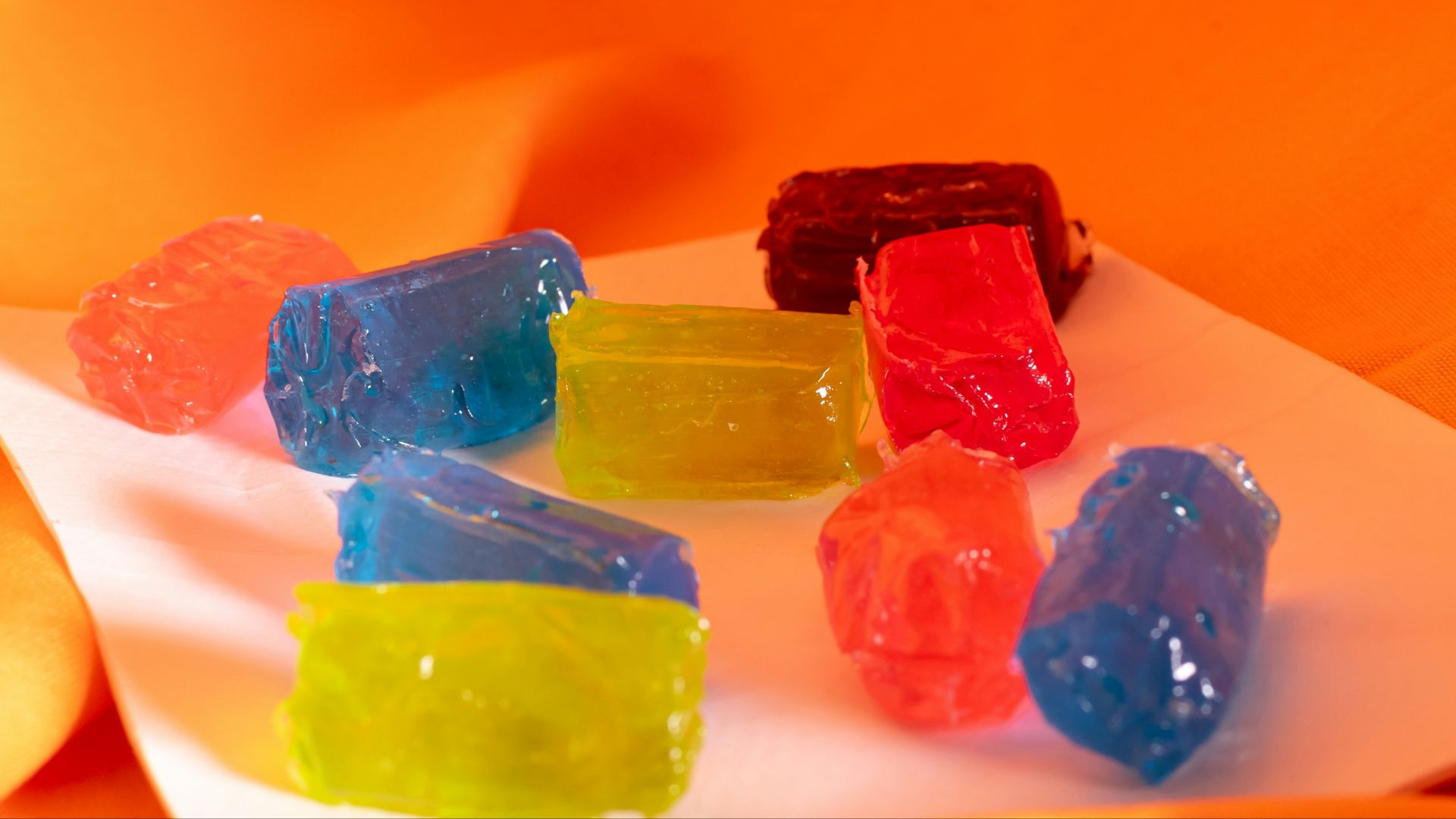 A bunch of gummy bears sitting on top of a white plate