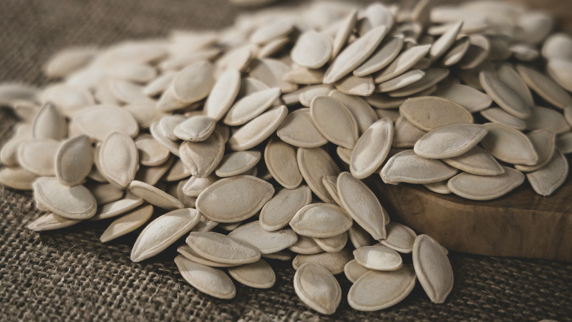 brown seeds on brown wooden surface