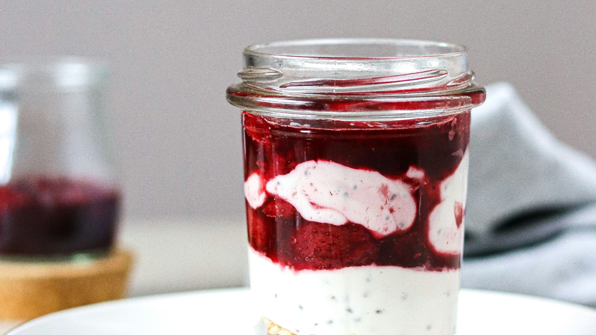 A jar of food sitting on top of a white plate