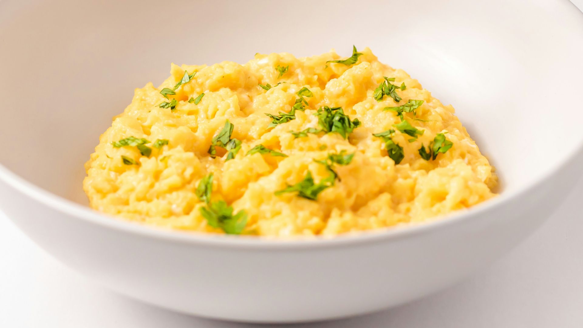 a close up of a bowl of food on a table