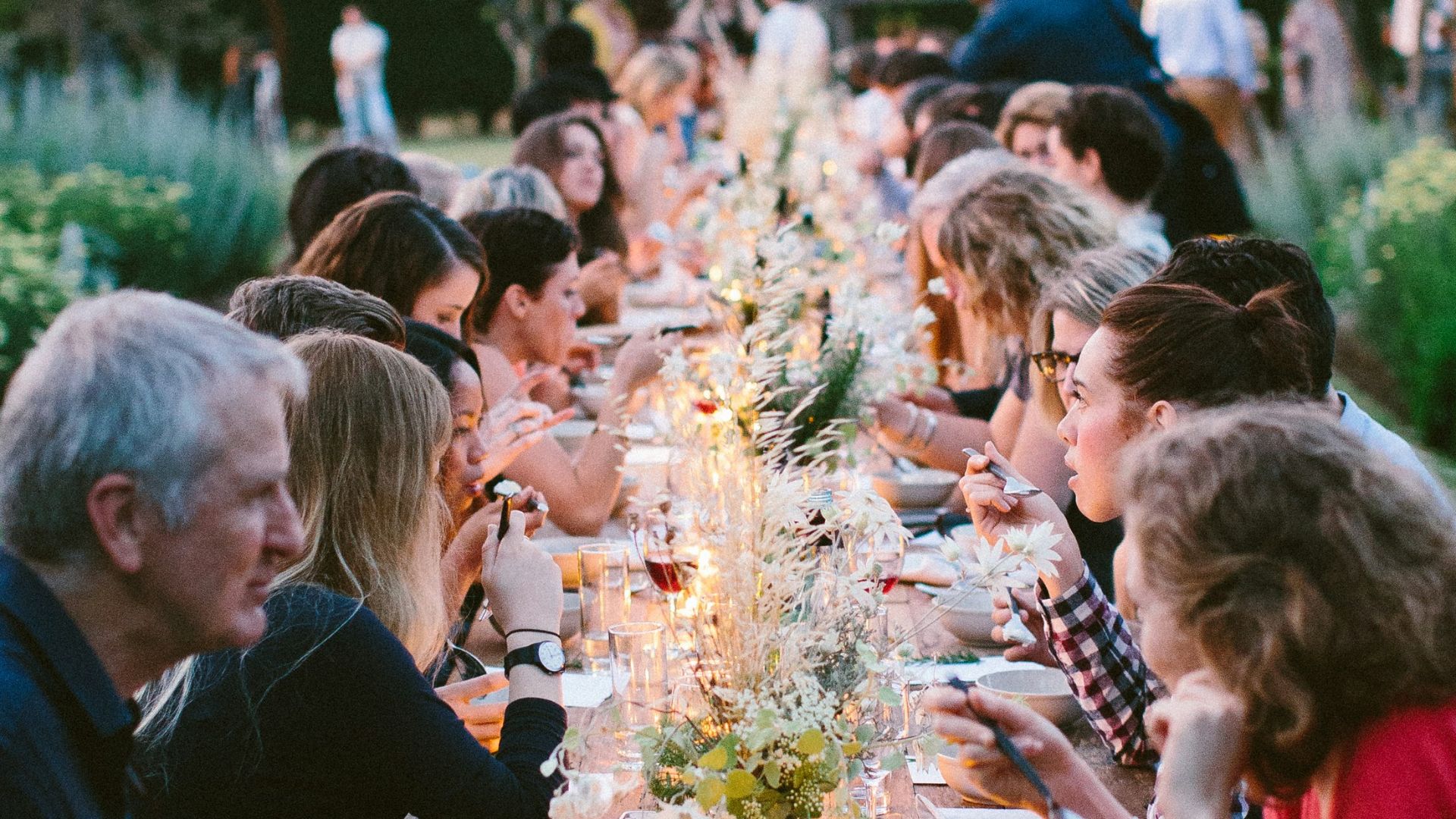 people sitting on chair in front of table during daytime