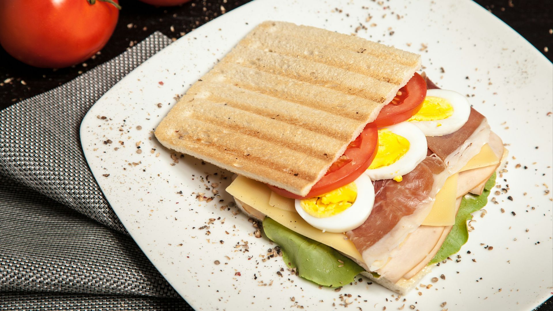 sandwich on top white plate