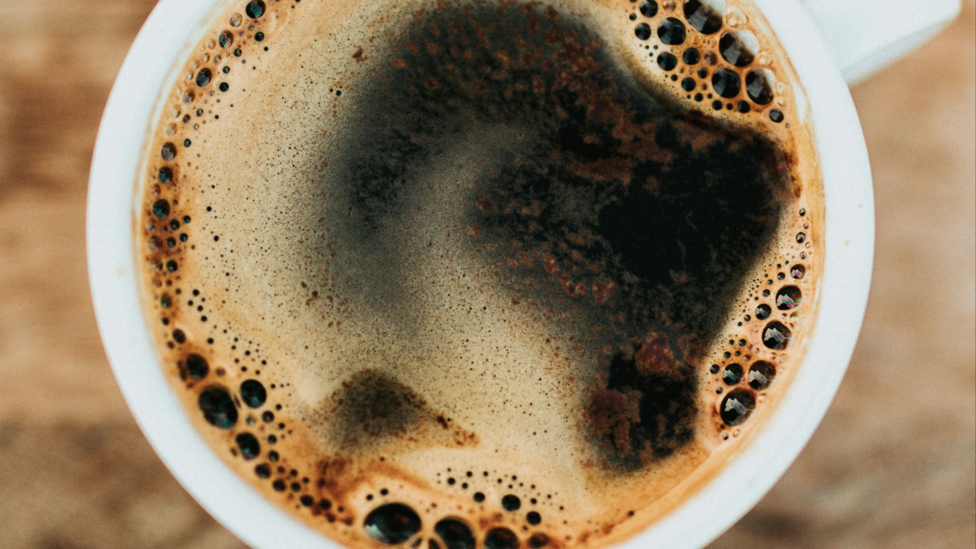 white ceramic mug filled with coffee