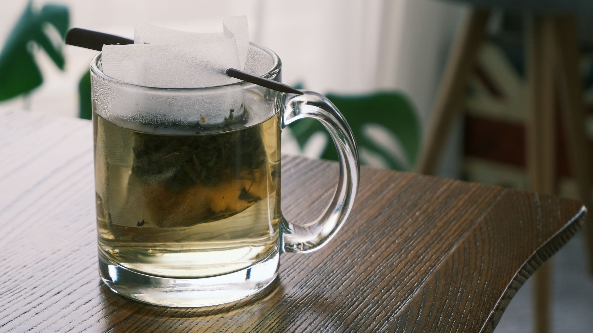 clear glass mug on brown wooden table