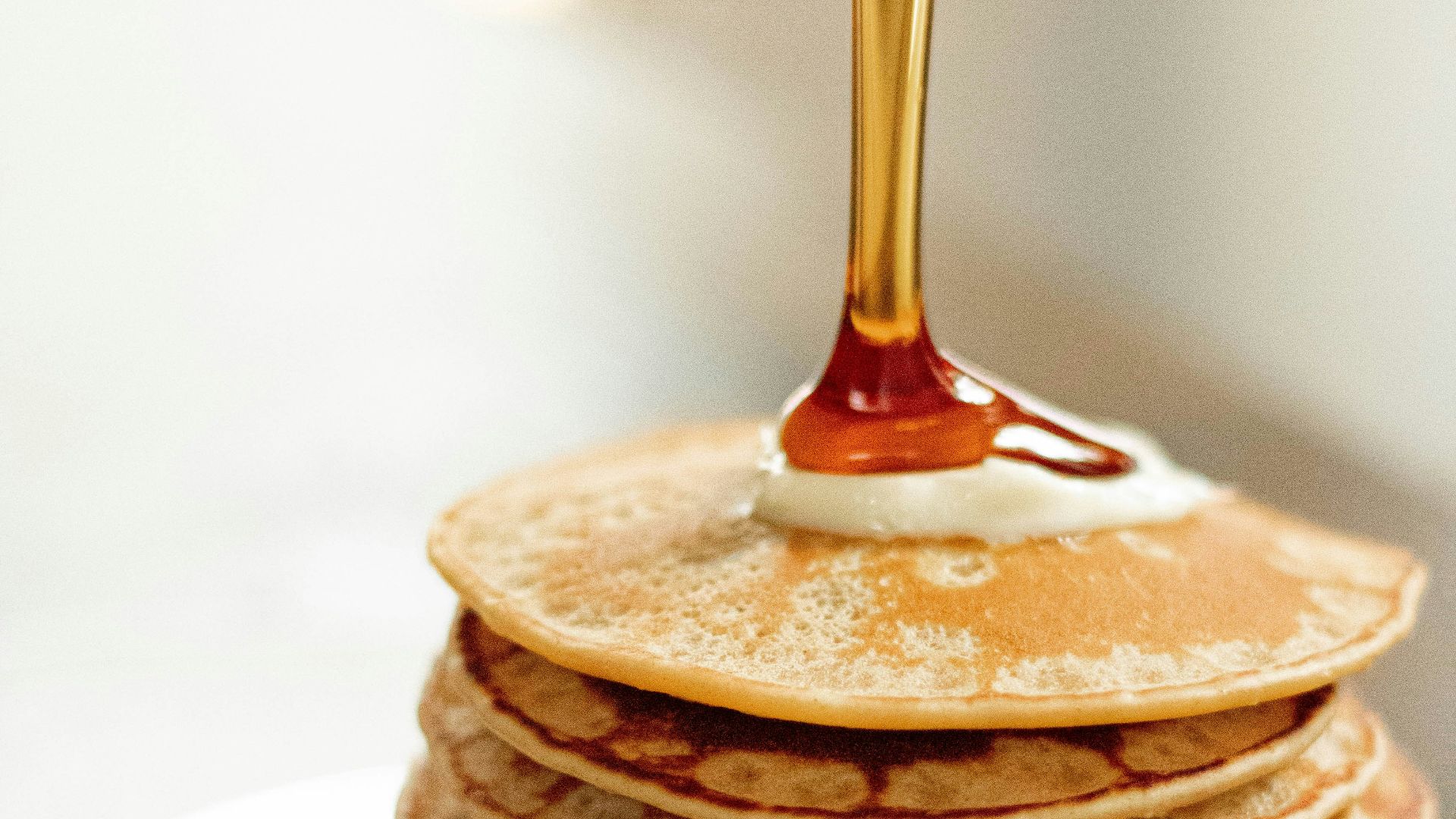 brown pancakes on white ceramic plate