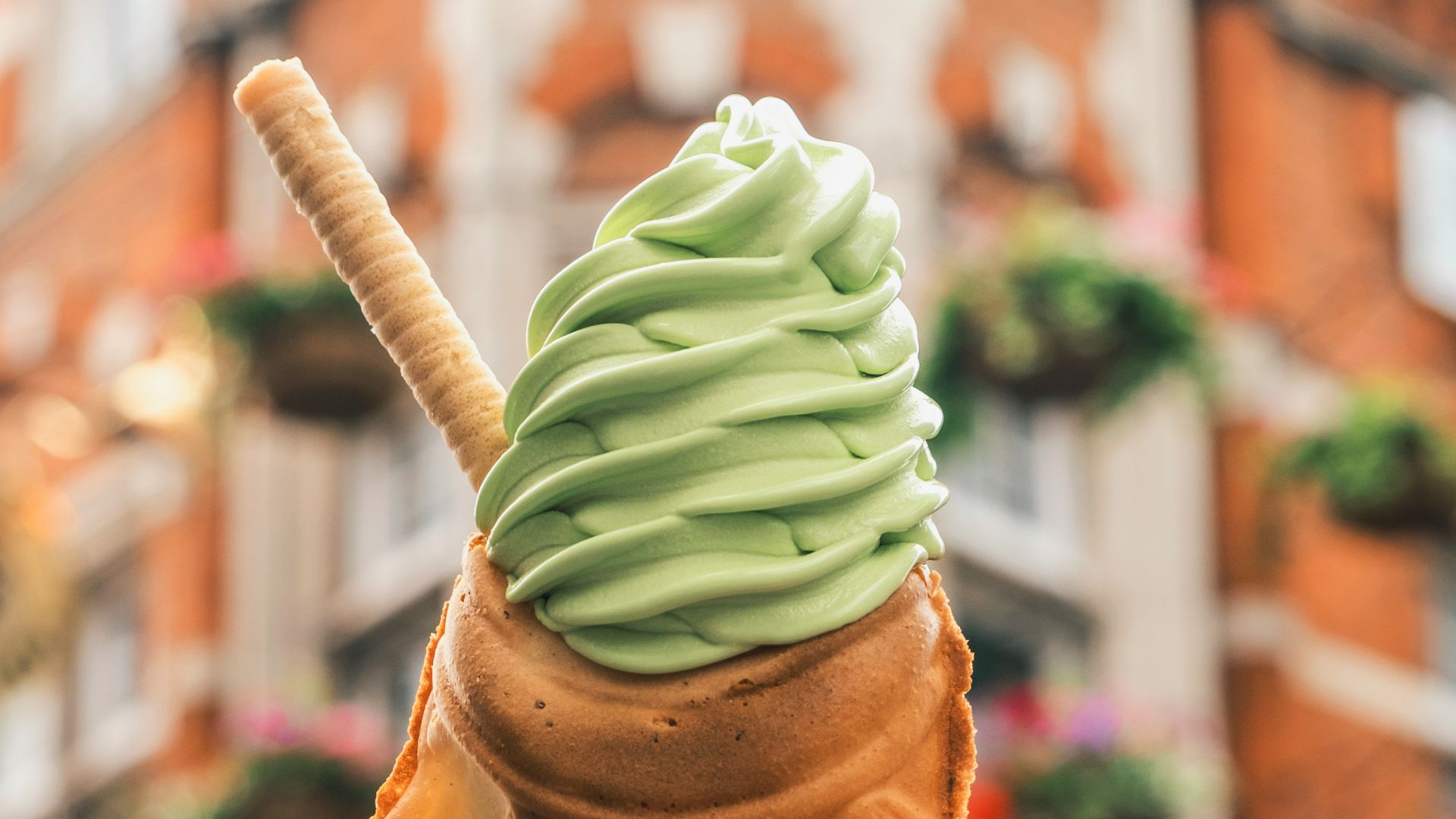 person holding brown ice cream cone