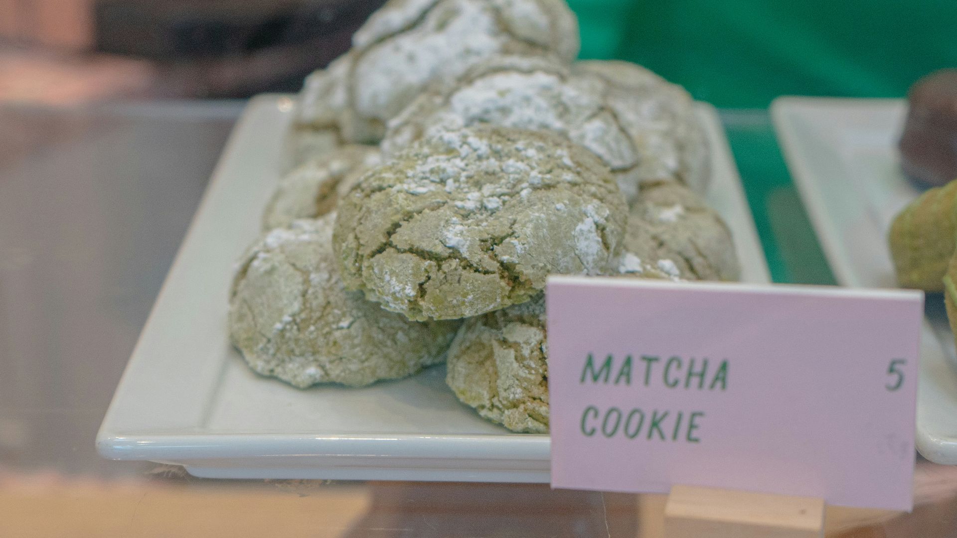 A display case filled with lots of different types of pastries